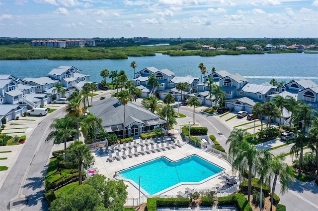 birds eye view of property with a water view