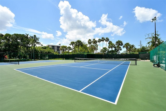 1328 Siesta Bayside Dr Unit 1328-C, Sarasota, FL 34242 - view of tennis court with community basketball court