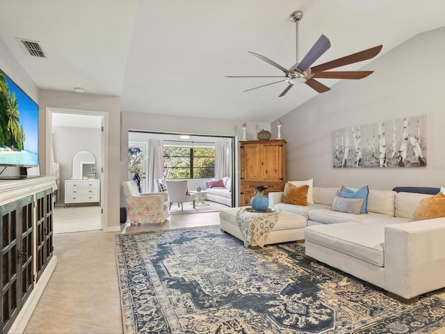 living room featuring ceiling fan and vaulted ceiling