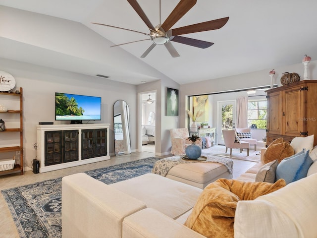 living room featuring ceiling fan and vaulted ceiling