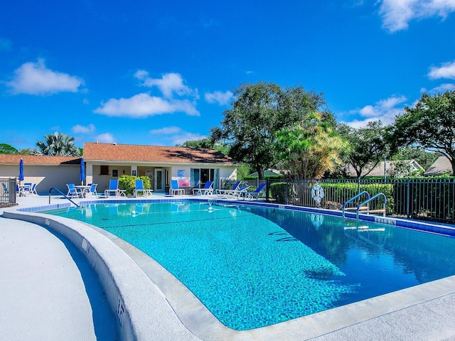 view of swimming pool featuring a patio area