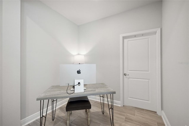 office space with light hardwood / wood-style flooring