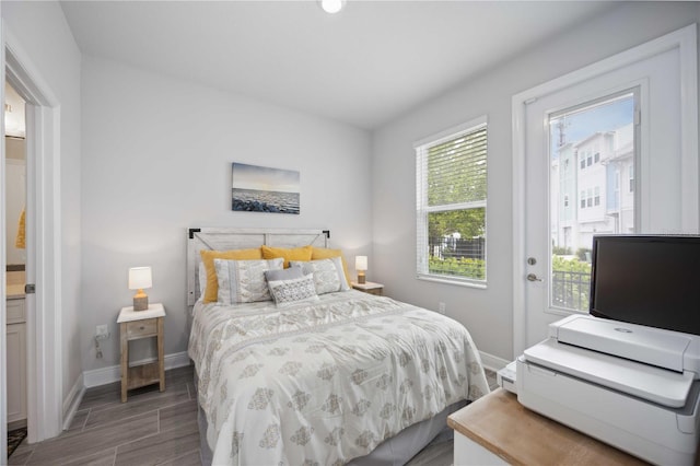 bedroom with dark hardwood / wood-style floors