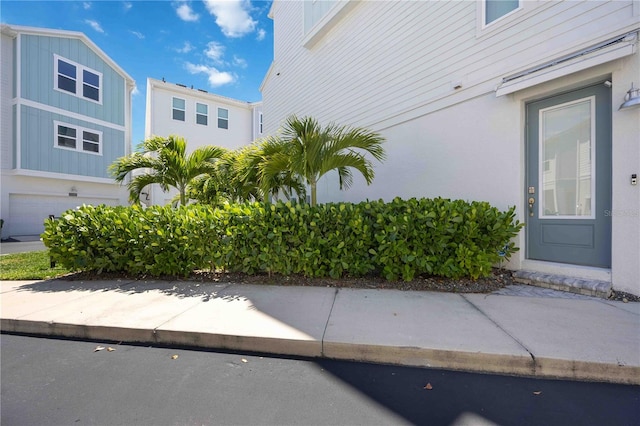 view of side of home with a garage