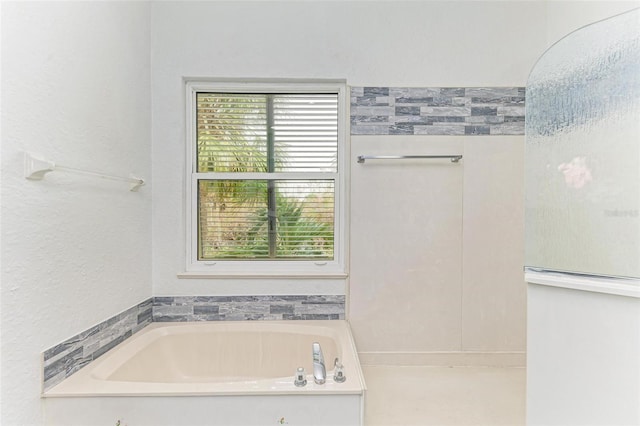 bathroom featuring a tub to relax in