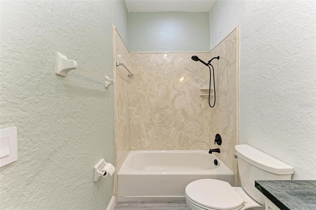 full bathroom with washtub / shower combination, vanity, and toilet