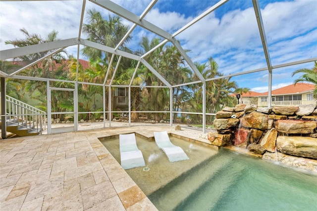 view of pool featuring a patio area and a lanai