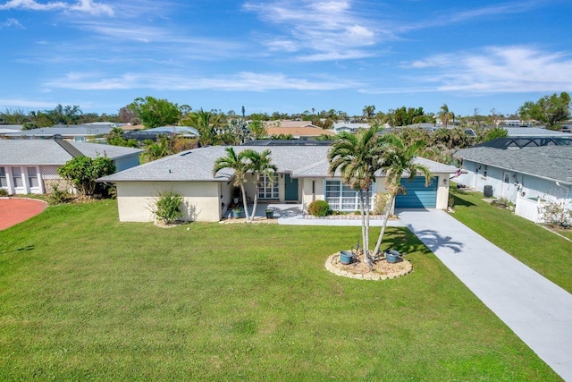 single story home with a front lawn and a garage