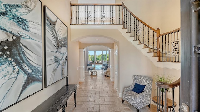 foyer with a towering ceiling