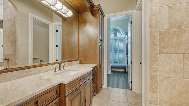 bathroom with vanity and tile patterned flooring