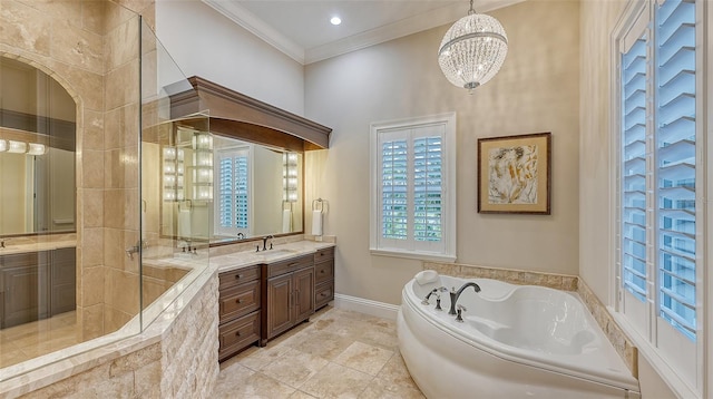 bathroom with tile patterned floors, a chandelier, tiled bath, vanity, and crown molding