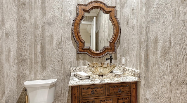 bathroom with toilet and vanity