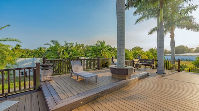 wooden deck featuring a water view