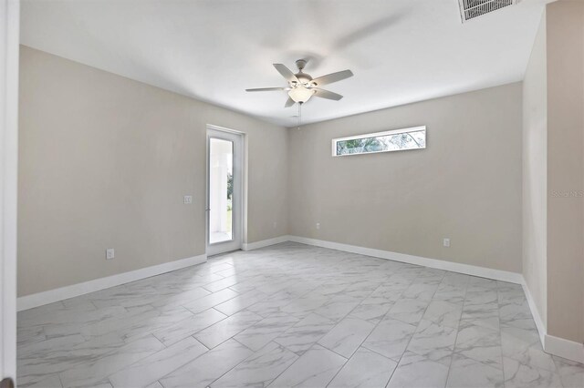 2814 Daphne Rd, North Port, FL 34288 - unfurnished room featuring light marble finish flooring and ceiling fan