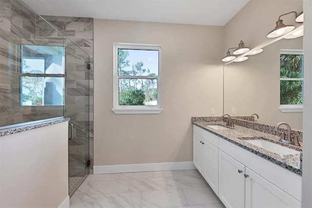 2814 Daphne Rd, North Port, FL 34288 - bathroom with marble finish floors, double vanity, and a stall shower