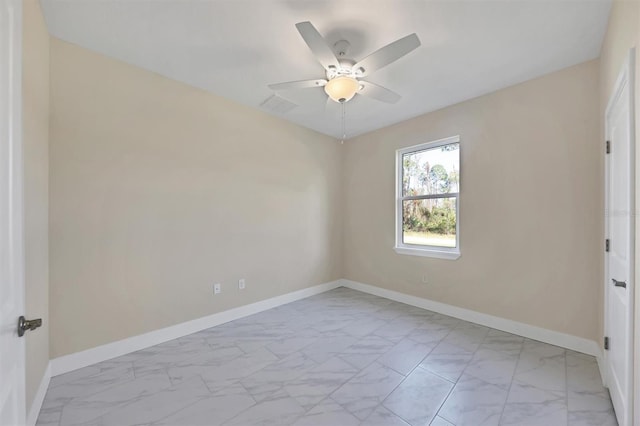 2814 Daphne Rd, North Port, FL 34288 - empty room featuring light marble finish flooring and a ceiling fan