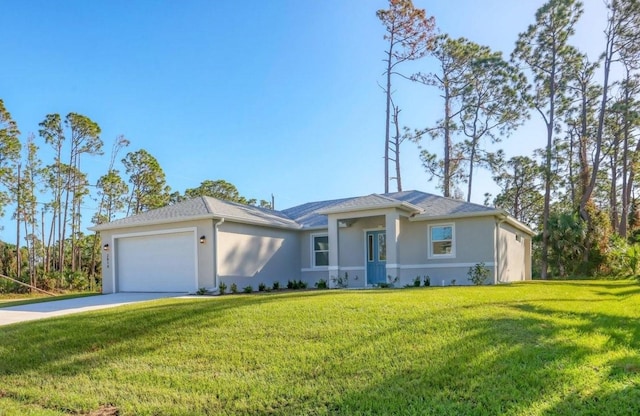 ranch-style home featuring a garage and a front yard