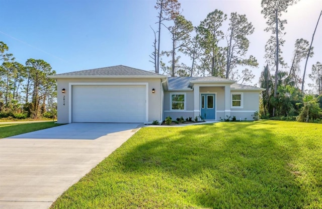 view of front facade with a garage and a front lawn