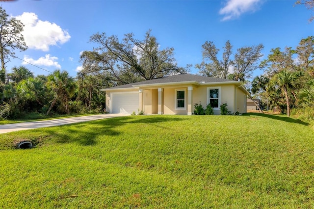 single story home featuring a garage and a front lawn