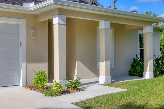 view of exterior entry featuring a garage