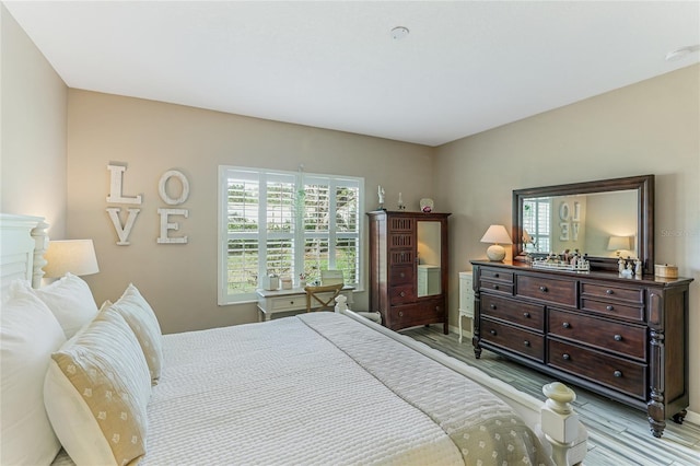 bedroom with light hardwood / wood-style floors