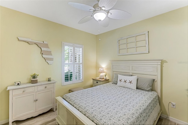 bedroom with light hardwood / wood-style floors and ceiling fan