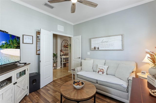 living room featuring ornamental molding, dark wood-type flooring, and ceiling fan