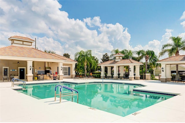 view of swimming pool featuring a gazebo and a patio area