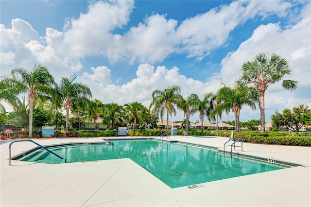 view of swimming pool with a patio