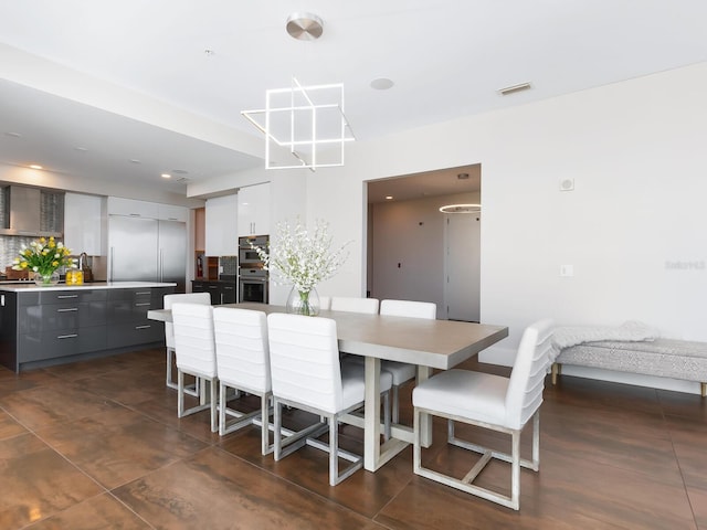 dining space with a chandelier