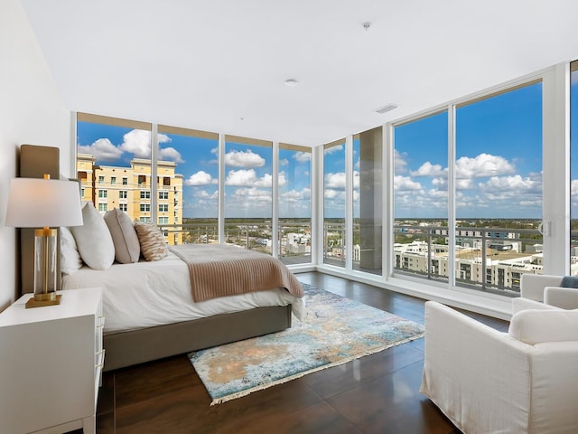 bedroom featuring a wall of windows