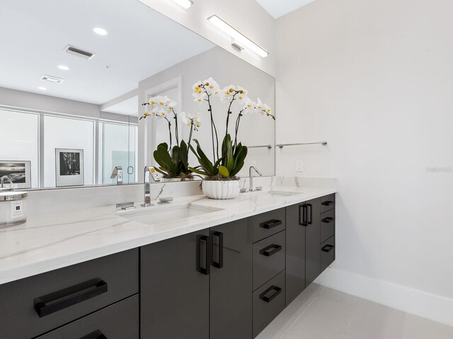 540 N Tamiami Trl Unit 1201, Sarasota, FL 34236 - bathroom featuring double vanity, tile patterned flooring, baseboards, recessed lighting, and an enclosed shower