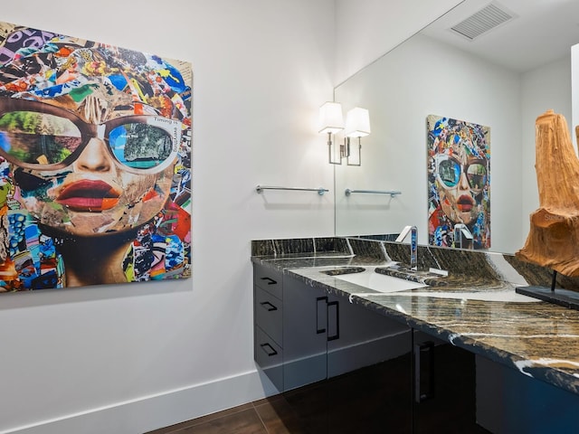 bathroom with vanity and tile patterned floors