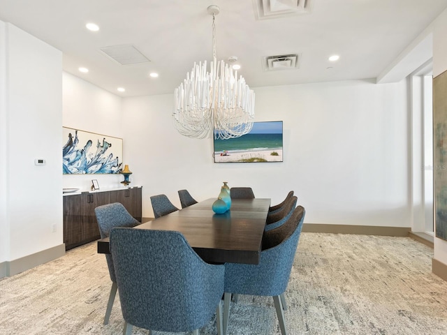 dining space with a chandelier