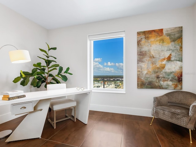 540 N Tamiami Trl Unit 1201, Sarasota, FL 34236 - home office with baseboards and dark tile patterned flooring
