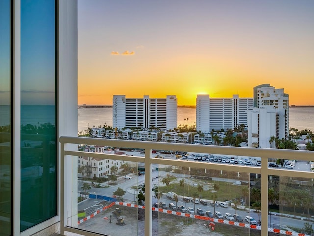 540 N Tamiami Trl Unit 1201, Sarasota, FL 34236 - balcony at dusk with a water view and a city view