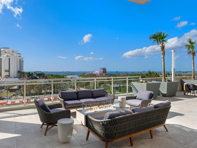 view of patio / terrace featuring outdoor lounge area and a water view