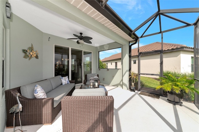 sunroom featuring ceiling fan