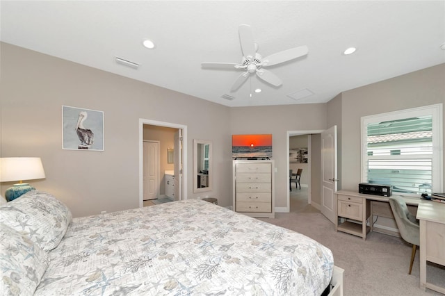 bedroom featuring connected bathroom, ceiling fan, and light colored carpet