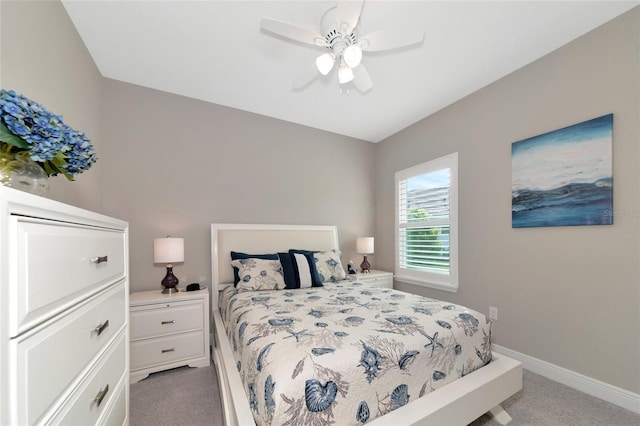 bedroom featuring ceiling fan and light carpet