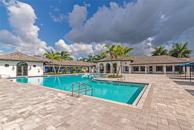 view of swimming pool with a patio