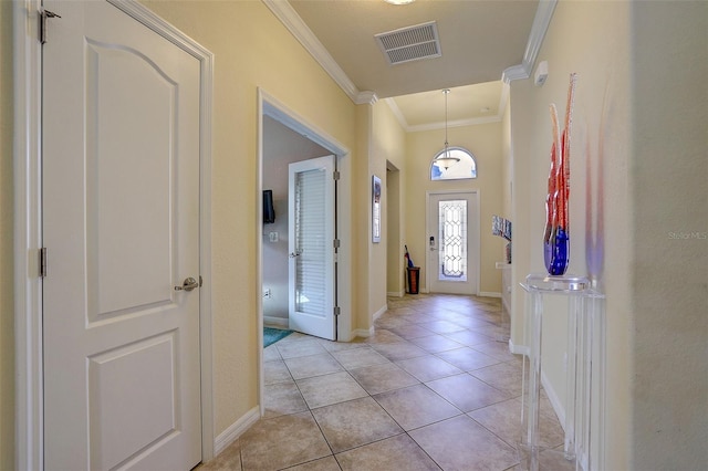 tiled entryway with crown molding