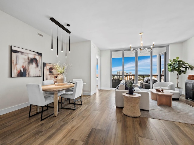 living room featuring hardwood / wood-style floors and an inviting chandelier