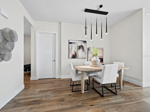 dining area featuring hardwood / wood-style flooring