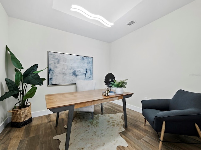 office with wood-type flooring