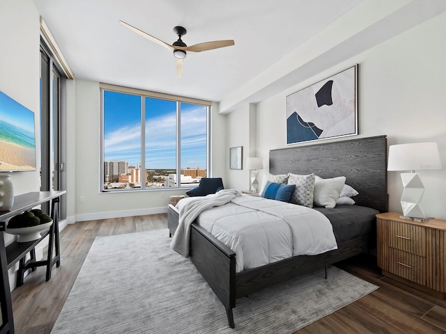 bedroom featuring hardwood / wood-style flooring and ceiling fan