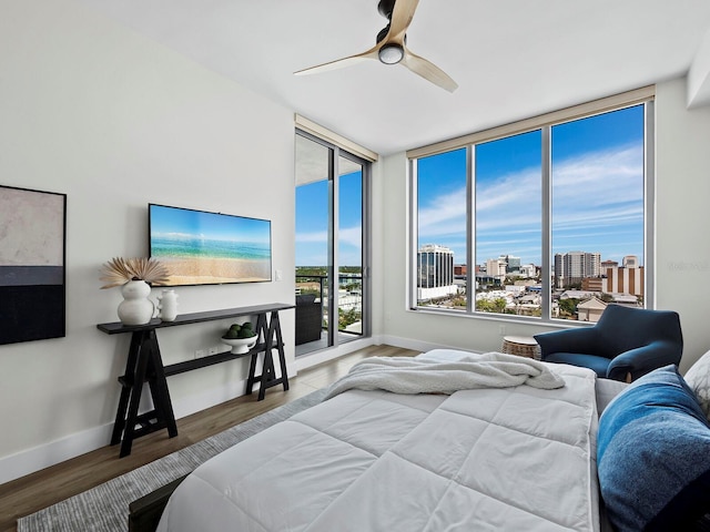 bedroom with hardwood / wood-style flooring and ceiling fan