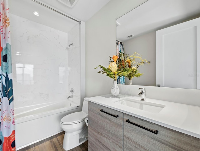 full bathroom featuring shower / bath combo, vanity, hardwood / wood-style flooring, and toilet