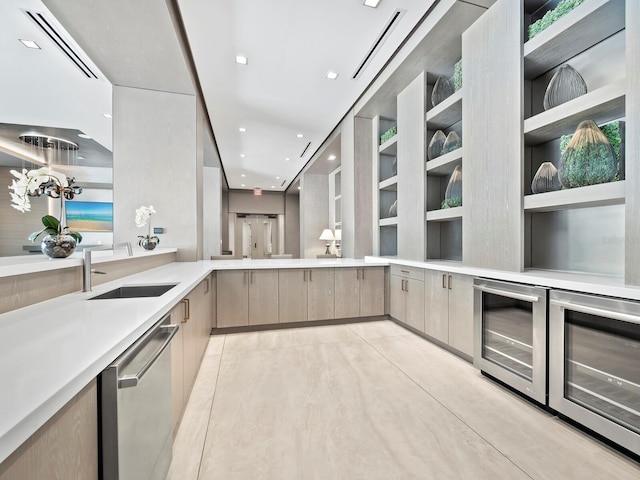 kitchen featuring dishwasher, sink, light brown cabinetry, and wine cooler