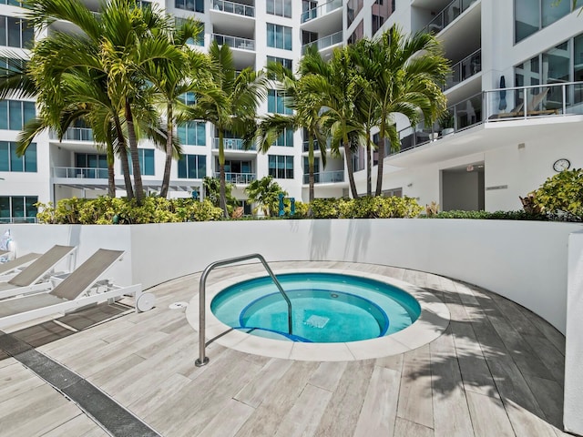 view of pool featuring a community hot tub